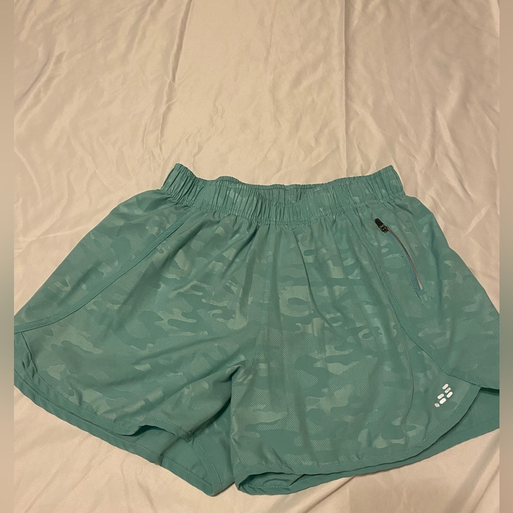 size M teal bcg running shorts fairly worn